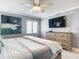 Main bedroom with king bed, large TV, and dresser at 5303 S Atlantic Ave # 270, New Smyrna Beach, FL 32169
