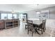Coastal dining room with wooden table and ocean view at 5303 S Atlantic Ave # 270, New Smyrna Beach, FL 32169