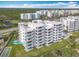 Oceanfront building, unit #27 highlighted, with lawn and shuffleboard at 5303 S Atlantic Ave # 270, New Smyrna Beach, FL 32169