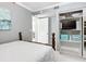 Guest bedroom with a double bed and built-in shelving at 5303 S Atlantic Ave # 270, New Smyrna Beach, FL 32169