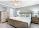 Main bedroom with king-size bed, wood dresser, and coastal decor at 5303 S Atlantic Ave # 270, New Smyrna Beach, FL 32169