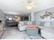 Open living room with sectional sofa and coastal decor at 5303 S Atlantic Ave # 270, New Smyrna Beach, FL 32169