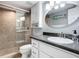 Bathroom with walk-in shower and granite countertop at 5303 S Atlantic Ave # 270, New Smyrna Beach, FL 32169