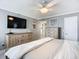 King bed, dresser, and coastal artwork in main bedroom at 5303 S Atlantic Ave # 270, New Smyrna Beach, FL 32169