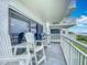 Ocean view from balcony with white chairs and railing at 5303 S Atlantic Ave # 270, New Smyrna Beach, FL 32169