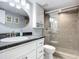 Bathroom with walk-in shower, vanity, and granite countertop at 5303 S Atlantic Ave # 270, New Smyrna Beach, FL 32169