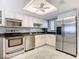 Modern kitchen, white cabinets, stainless steel appliances at 5303 S Atlantic Ave # 270, New Smyrna Beach, FL 32169