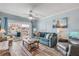 Bright living room with comfy seating, large windows, and ocean views at 3801 S Atlantic Ave # 307, New Smyrna Beach, FL 32169