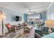 Bright living room with coastal decor and balcony access at 3801 S Atlantic Ave # 307, New Smyrna Beach, FL 32169