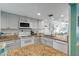 Open concept kitchen with granite countertops and white cabinets at 3801 S Atlantic Ave # 307, New Smyrna Beach, FL 32169