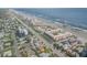 Large aerial view of the building and surrounding area at 3801 S Atlantic Ave # 307, New Smyrna Beach, FL 32169