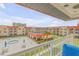 Balcony view of the complex courtyard and pool area at 3801 S Atlantic Ave # 307, New Smyrna Beach, FL 32169