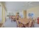 Indoor community room with tables and chairs at 3801 S Atlantic Ave # 307, New Smyrna Beach, FL 32169