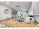 Bright kitchen boasts granite countertops, white appliances, and light gray cabinets at 3801 S Atlantic Ave # 307, New Smyrna Beach, FL 32169