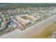 Wide aerial view of the building and surrounding area at 3801 S Atlantic Ave # 307, New Smyrna Beach, FL 32169