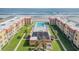 Aerial view of the complex showing pool and ocean access at 3801 S Atlantic Ave # 307, New Smyrna Beach, FL 32169