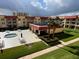 Community courtyard with tables, chairs and hot tub at 3801 S Atlantic Ave # 307, New Smyrna Beach, FL 32169