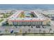 Aerial view of an oceanfront building with parking and pool at 3801 S Atlantic Ave # 307, New Smyrna Beach, FL 32169
