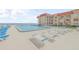 Resort-style pool with ample lounge chairs and ocean views at 3801 S Atlantic Ave # 307, New Smyrna Beach, FL 32169