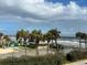 View of the beach, playground, and oceanfront amenities at 3801 S Atlantic Ave # 307, New Smyrna Beach, FL 32169