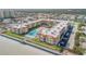 Aerial view showcasing building, pool, and parking at 3801 S Atlantic Ave # 307, New Smyrna Beach, FL 32169