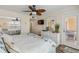 Main bedroom with king bed, dresser, and access to balcony at 3801 S Atlantic Ave # 307, New Smyrna Beach, FL 32169