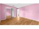 Pink bedroom with mirrored closet doors at 172 Gull S Dr, Daytona Beach, FL 32119