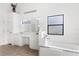 Bright bathroom with double vanity and a soaking tub at 172 Gull S Dr, Daytona Beach, FL 32119