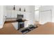 Bright kitchen with white cabinets, stainless steel appliances, and a double sink at 172 Gull S Dr, Daytona Beach, FL 32119