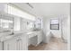 Bathroom features double sinks and a shower/tub combo at 172 Gull S Dr, Daytona Beach, FL 32119