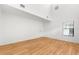 Spacious bedroom with laminate wood flooring and a window with mini blinds at 172 Gull S Dr, Daytona Beach, FL 32119