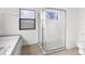 Bathroom with shower, tile flooring, and a window at 172 Gull S Dr, Daytona Beach, FL 32119