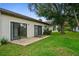 Backyard view with patio and sliding doors at 172 Gull S Dr, Daytona Beach, FL 32119