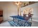 Game room with ping pong table, access to kitchen, and high ceilings at 3608 Romea Cir, New Smyrna Beach, FL 32168