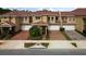 Three-unit townhome building with brick pavers and landscaping at 3608 Romea Cir, New Smyrna Beach, FL 32168