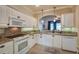 Kitchen with white cabinets, granite countertops, and stainless steel appliances at 3608 Romea Cir, New Smyrna Beach, FL 32168