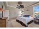 Primary bedroom with a king-size bed and access to bathroom at 3608 Romea Cir, New Smyrna Beach, FL 32168