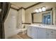 Bathroom with white vanity, tub, and decorative curtain at 3608 Romea Cir, New Smyrna Beach, FL 32168