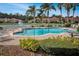 Community pool with lounge chairs, landscaping, and nearby residences at 3608 Romea Cir, New Smyrna Beach, FL 32168