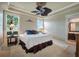 Spacious Primary bedroom with large windows, ceiling fan, and plenty of natural light at 3608 Romea Cir, New Smyrna Beach, FL 32168