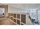 Upstairs hallway with built-in shelving and carpet at 3608 Romea Cir, New Smyrna Beach, FL 32168