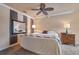 Spacious bedroom with a king-size bed and ceiling fan at 3608 Romea Cir, New Smyrna Beach, FL 32168