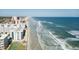 Aerial view of building and beach at 4153 S Atlantic Ave # 5010, New Smyrna Beach, FL 32169