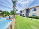 Condo building with lazy river and lush landscaping at 452 Bouchelle Dr # 303, New Smyrna Beach, FL 32169