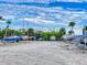 Outdoor boat storage area with various boats and trailers at 452 Bouchelle Dr # 303, New Smyrna Beach, FL 32169
