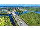 Aerial view of bridge, waterway and coastal landscape at 452 Bouchelle Dr # 303, New Smyrna Beach, FL 32169