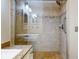 Walk-in shower with tiled walls and seat at 452 Bouchelle Dr # 303, New Smyrna Beach, FL 32169