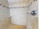 Large walk-in shower with tiled walls at 452 Bouchelle Dr # 303, New Smyrna Beach, FL 32169