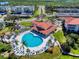 Heart-shaped community pool with lounge chairs and landscaping at 452 Bouchelle Dr # 303, New Smyrna Beach, FL 32169