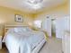 King-size bed in spacious main bedroom with ensuite bathroom at 452 Bouchelle Dr # 303, New Smyrna Beach, FL 32169